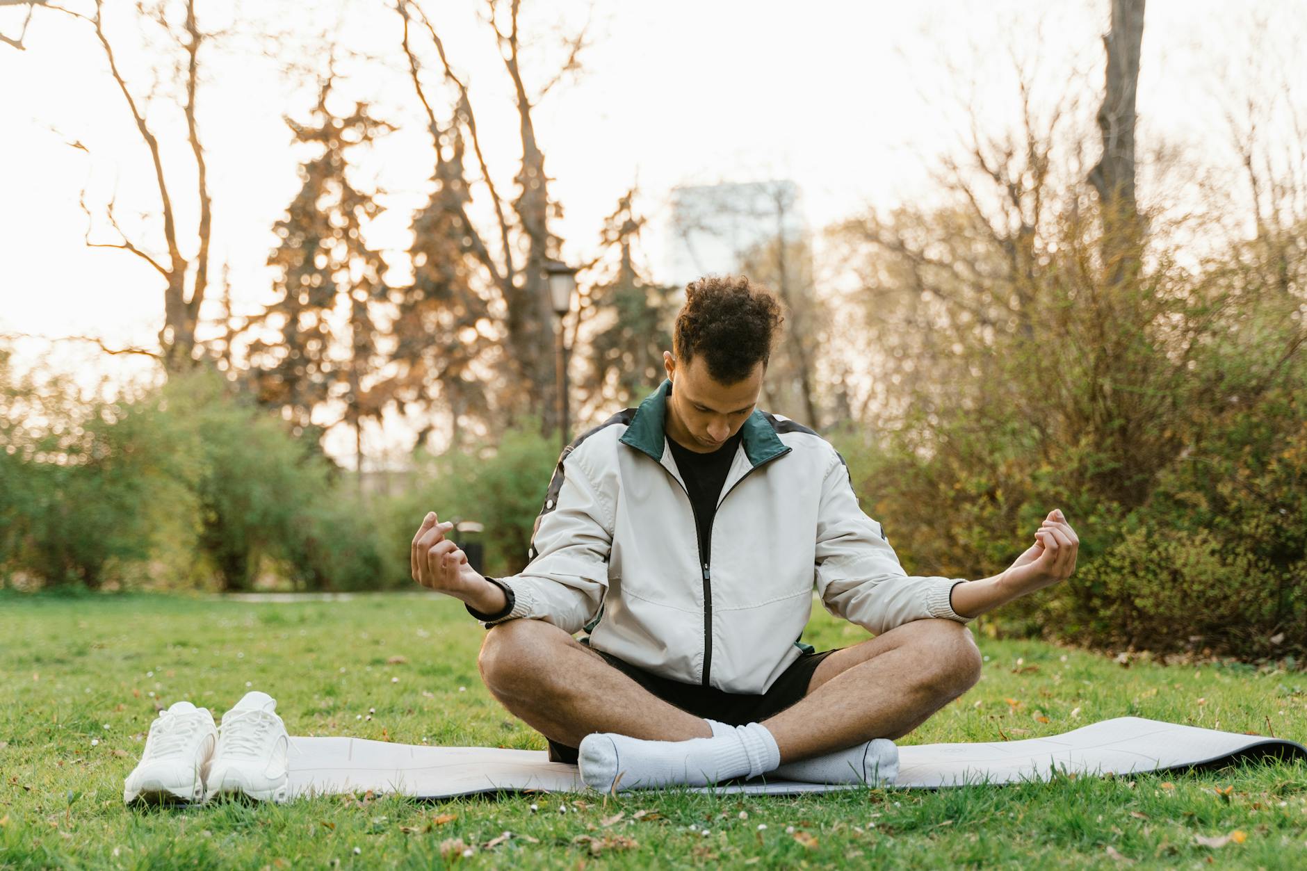 person meditating sunrise