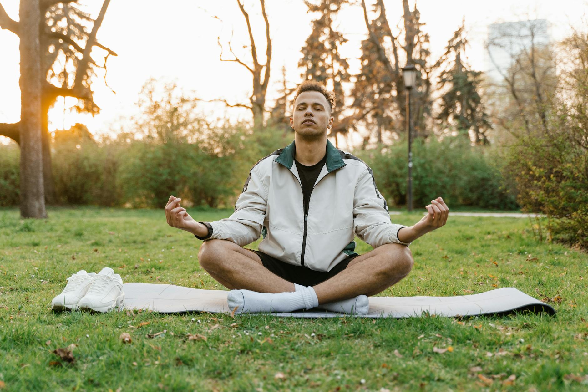 person meditating outdoors