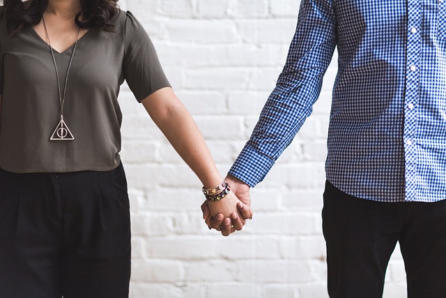 hand holding a credit card with a 'stop' sign over it