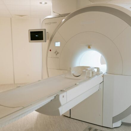 radiology tech working with equipment
